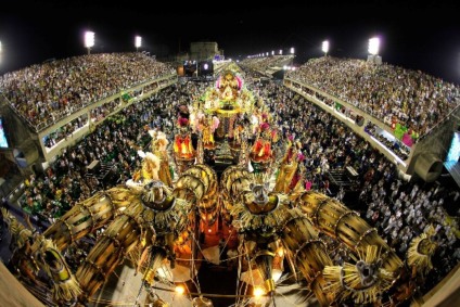 Revellers attend to XXXXXXXX Samba School parade during Rio de Janeiro’s carnival on Marques de Sapucai Sambodromo.