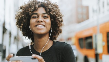 Girl listening to music from her phone
