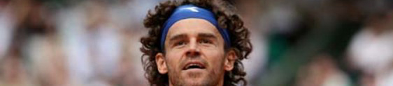 Brazilian player Gustavo Kuerten reacts during during his French tennis Open first round match against his French opponent Paul-Henri Mathieu at Roland Garros, on May 25, 2008 in Paris. AFP PHOTO / Thomas Coex (Photo credit should read THOMAS COEX/AFP/Getty Images)