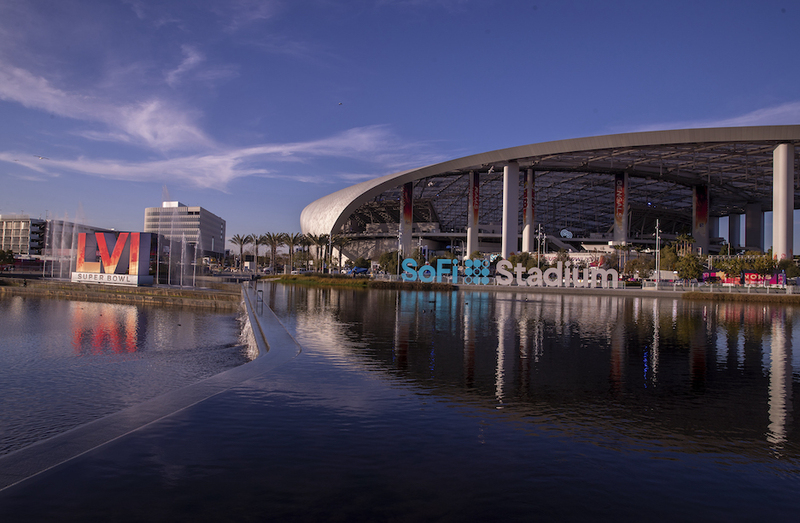 Los Angeles, CA – February 09: Workers make last minute preparations for the Super Bowl as viewed from the lake at SoFi Stadium in Los Angeles Wednesday, Feb. 9, 2022. (Allen J. Schaben / Los Angeles Times via Getty Images)