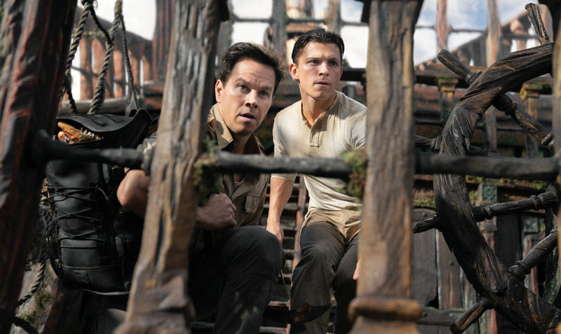 Victor “Sully” Sullivan (Mark Wahlberg) and Nathan Drake (Tom Holland) look to make their move in Columbia Pictures’ UNCHARTED. photo by: Clay Enos