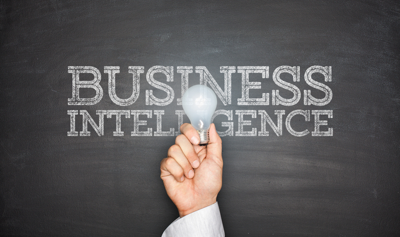 Business intelligence concept on blackboard with light bulb