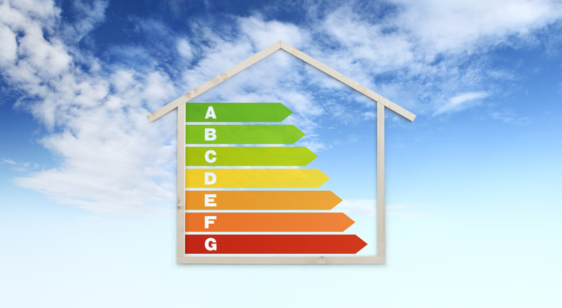 house shape and energy efficiency chart symbol, isolated on sky background, green buildings and save energy eco sustainability