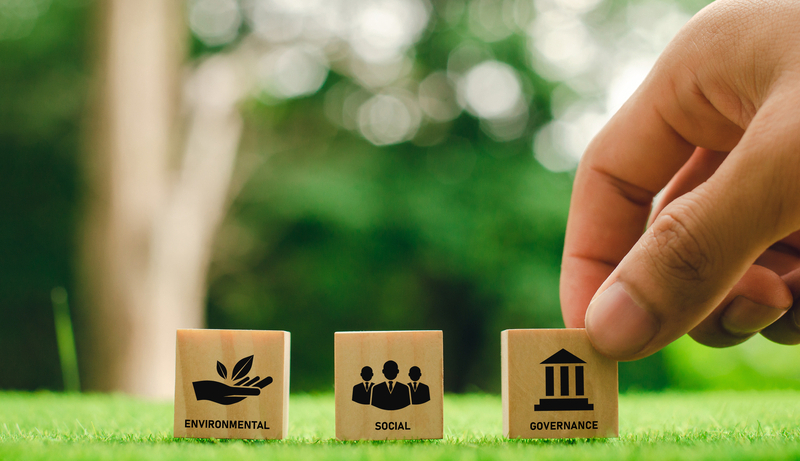 The term ESG on the Wood Block and the future environmental conservation and sustainable ESG modernization using renewable resource technologies to reduce pollution and carbon emissions.