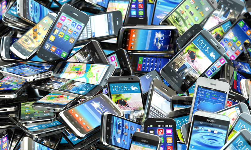 Mobile phones background. Pile of different modern smartphones. 3d