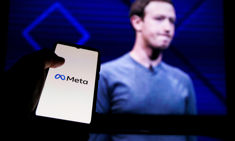 Meta logo on screen and Mark Zuckerberg is a Chief Executive Officer of Metaverse in background