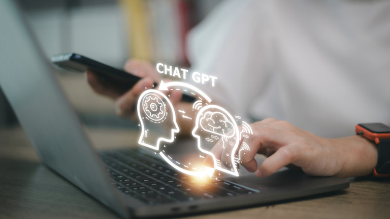 ChatGPT Chat with AI or Artificial Intelligence. woman chatting with a smart AI or artificial intelligence using an artificial intelligence chatbot developed by OpenAI.