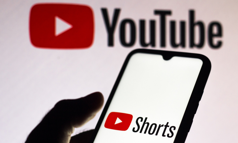 September 21, 2020, Brazil. In this photo illustration a YouTube Shorts logo is seen displayed on a smartphone with an YouTube logo on the background