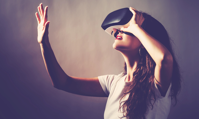 Young woman using a virtual reality headset