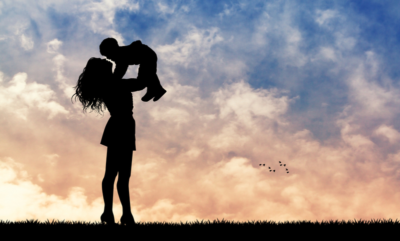 mother and son at sunset