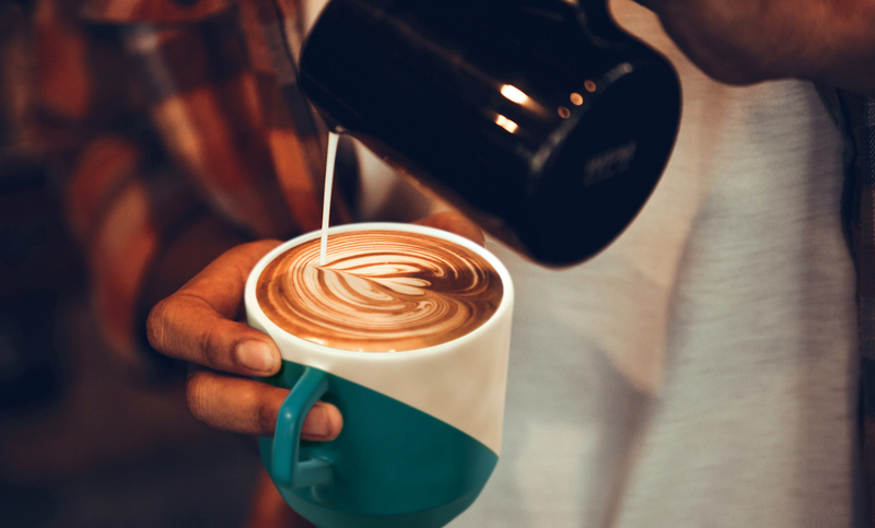 Coffee workshop barista make a Coffee latte art Selective focus white cup.color vintage style.; Shutterstock ID 1107097526; BDC (n° only): -; Client: –