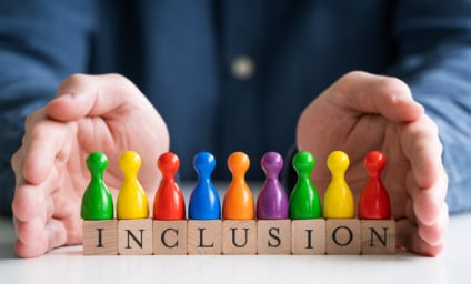 Man Protecting Inclusion Text And Multi Colored Pawns