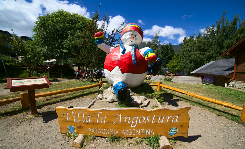 VILLA LA ANGOSTURA, ARGENTINA – JANUARY 12, 2016: Snowman statue standing next to the bus terminal, photographed on January 12, 2016 in Villa la Angostura, Argentinian Patagonia. This town is visited in winter for the nearby ski resort, and is also popular in summer.