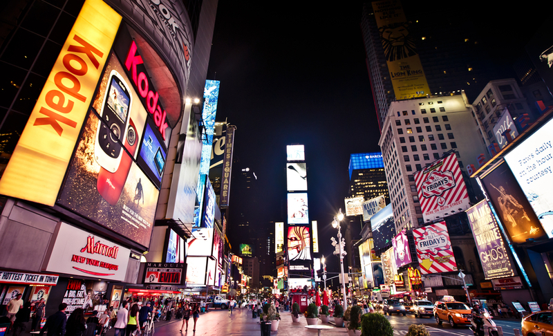 NEW YORK CITY – AUGUST 20: Times Square, is a busy tourist intersection of neon art and commerce and is an iconicplace of New York City and USA on August 20, 2012 in Manhattan, New York City.