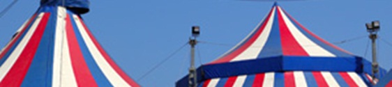 Circus tent under blue sky colorful stripes red white
