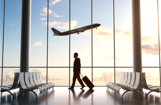 young man in airport and airplane in sky