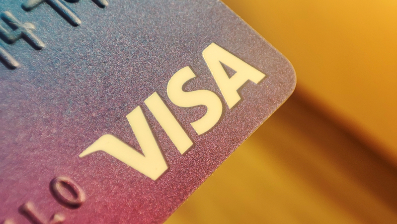 Warsaw Poland, December 2, 2022: Visa plastic electronic card closeup macro. American company providing services of payment operations.