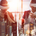 two business persons are developing a project using virtual reality goggles. the concept of technologies of the future