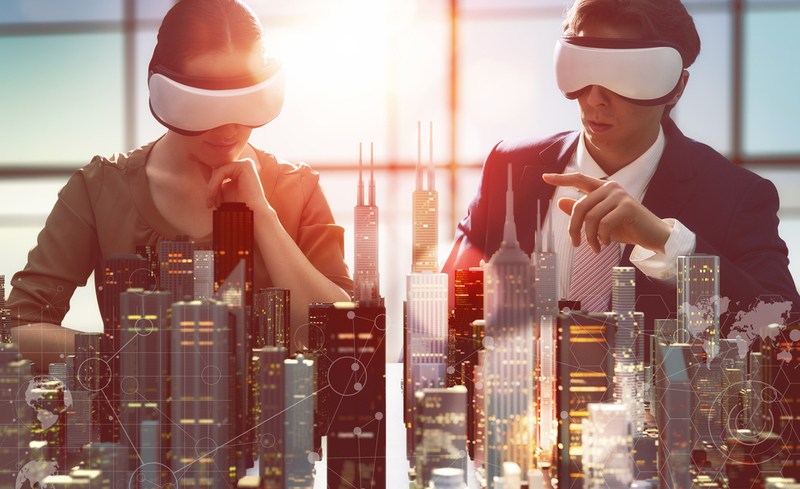 two business persons are developing a project using virtual reality goggles. the concept of technologies of the future